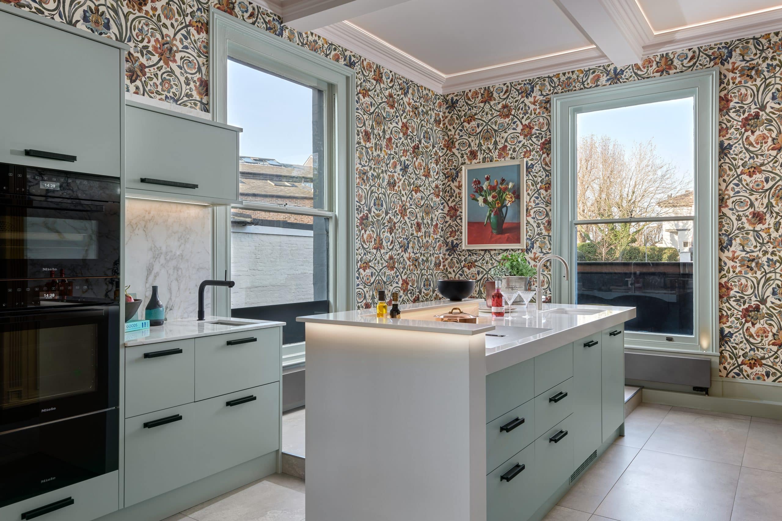 Modern kitchen island with Quooker tap and integrated appliances